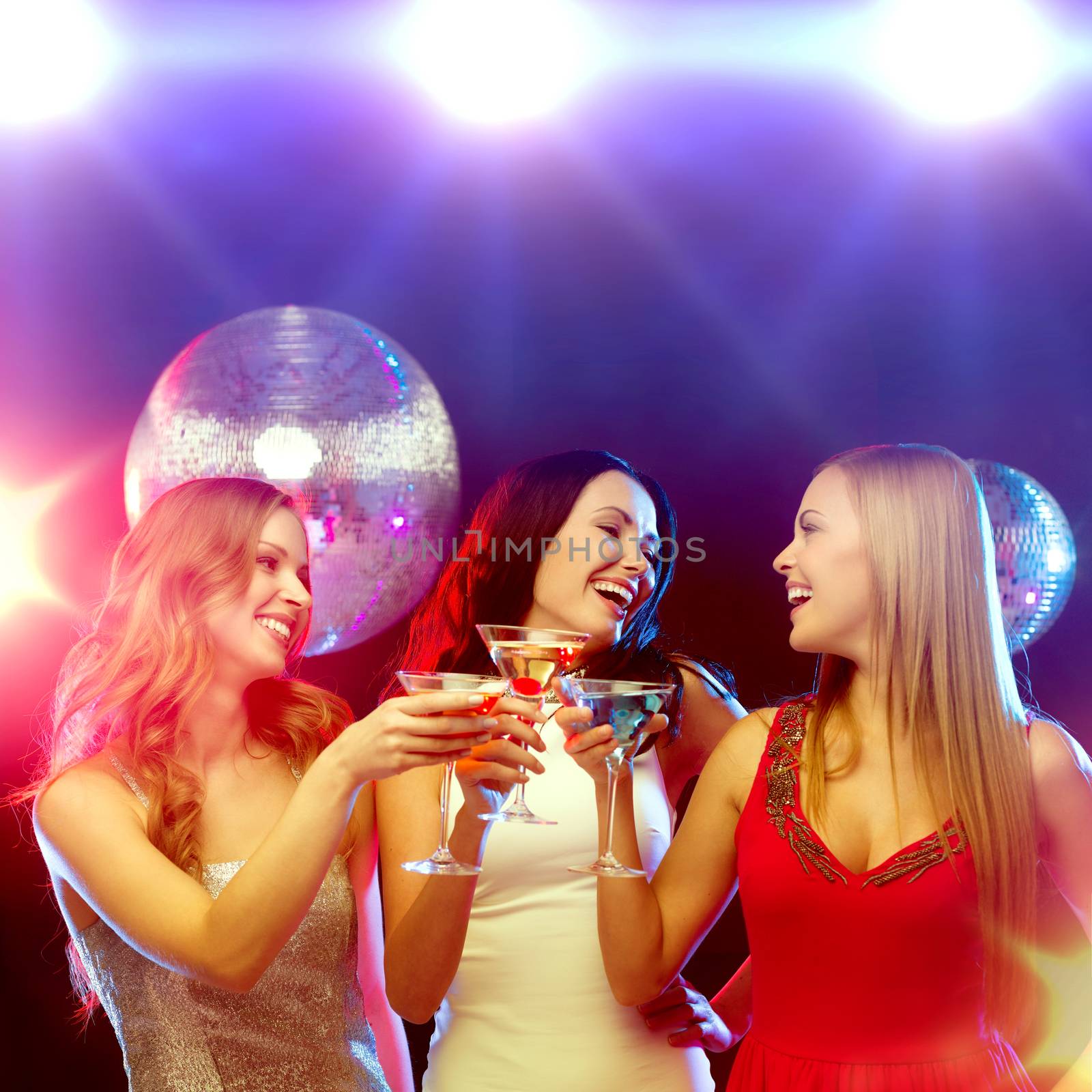 new year celebration, friends, bachelorette party, birthday concept - three women in evening dresses with cocktails and disco ball