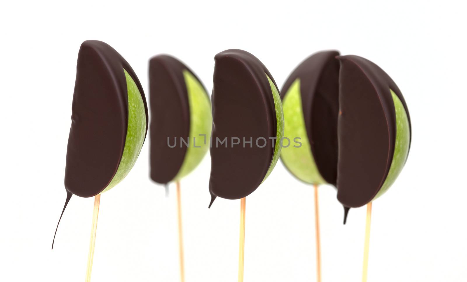 Chocolate dipped apple fruit on a white background