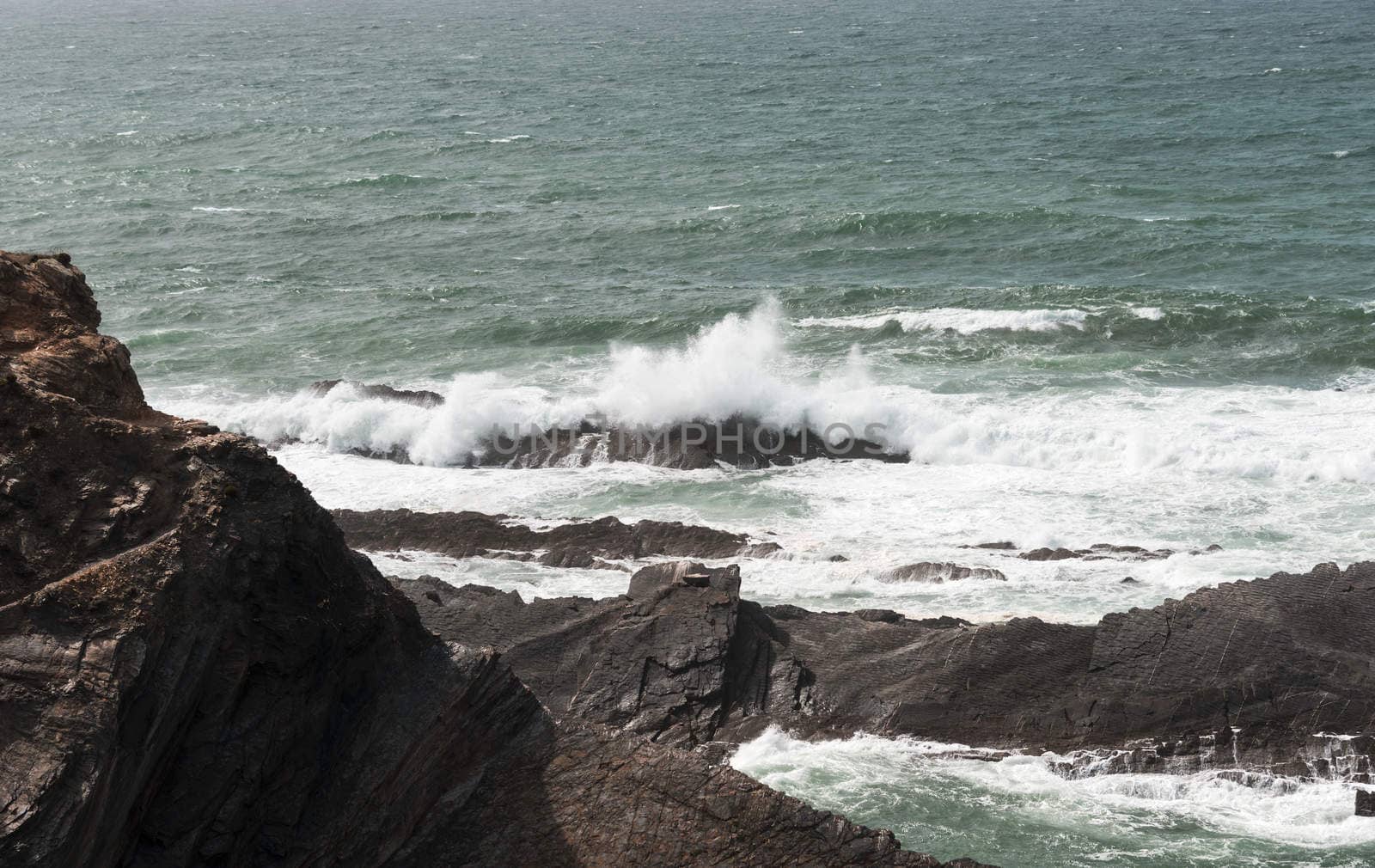 water splashing on the rocks at the atlantic ocean