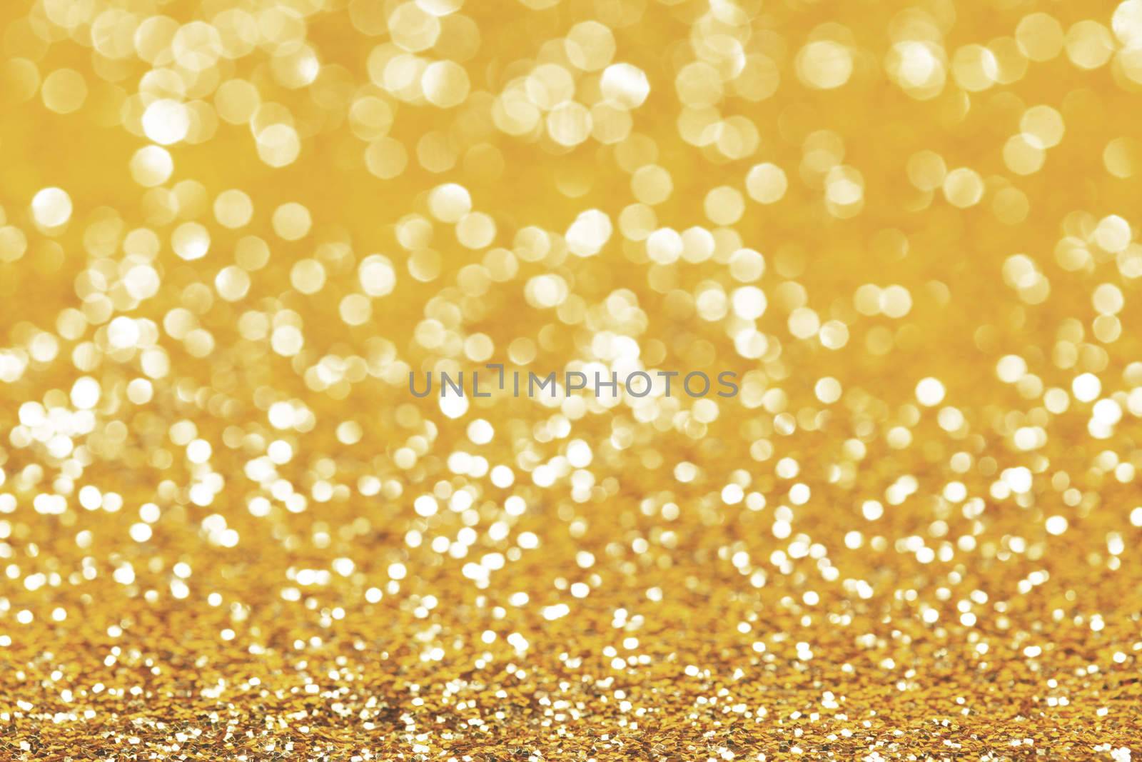 Abstract shining glitters gold holiday bokeh background