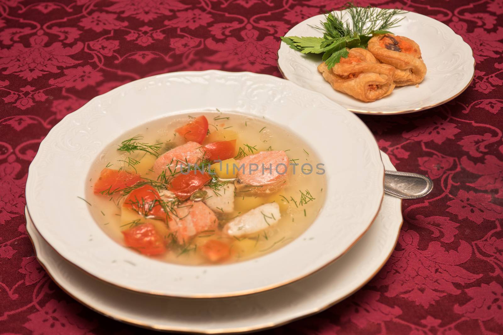 Fish salmon soup in white plate