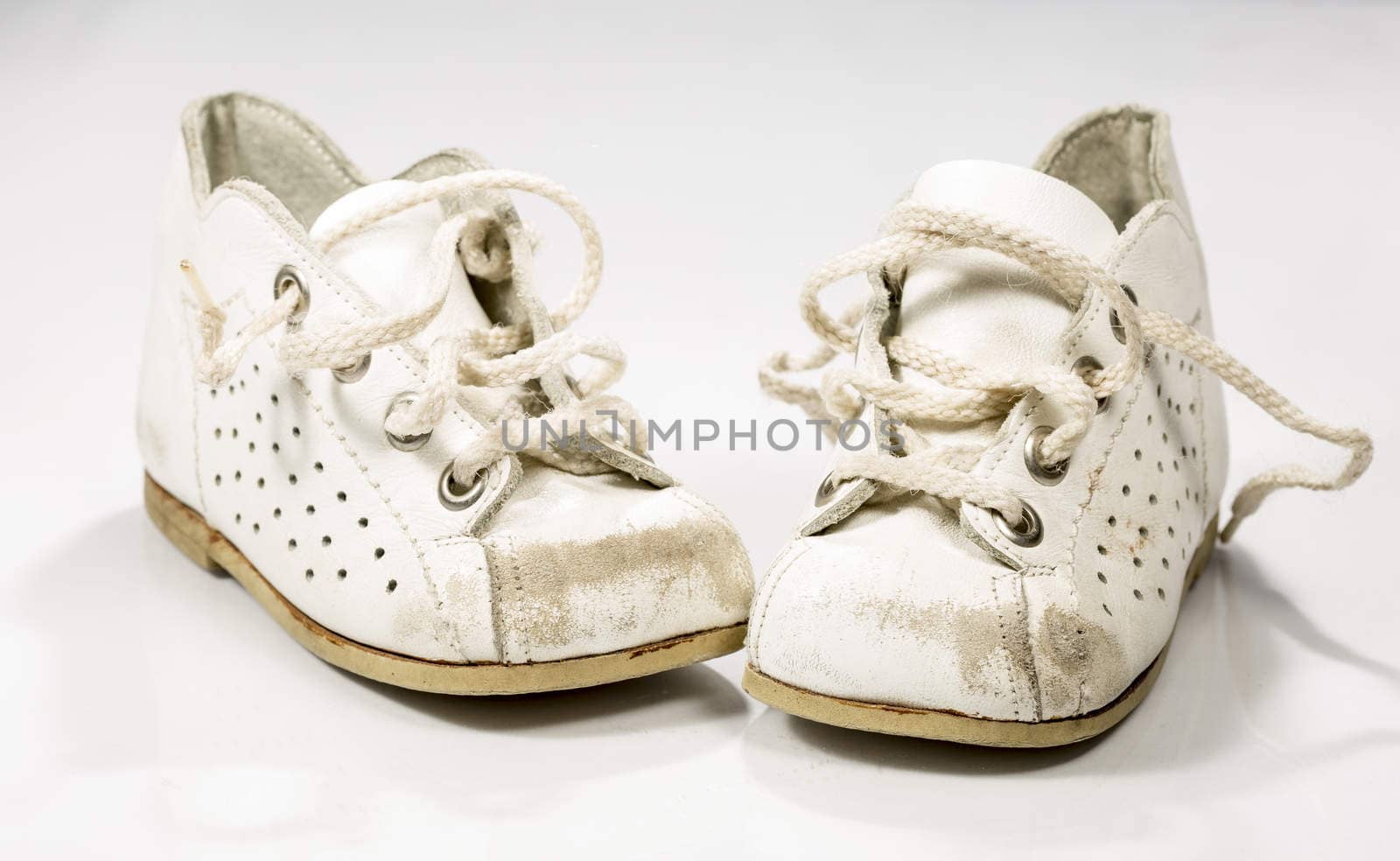 Kids Shoes Untied on white background.