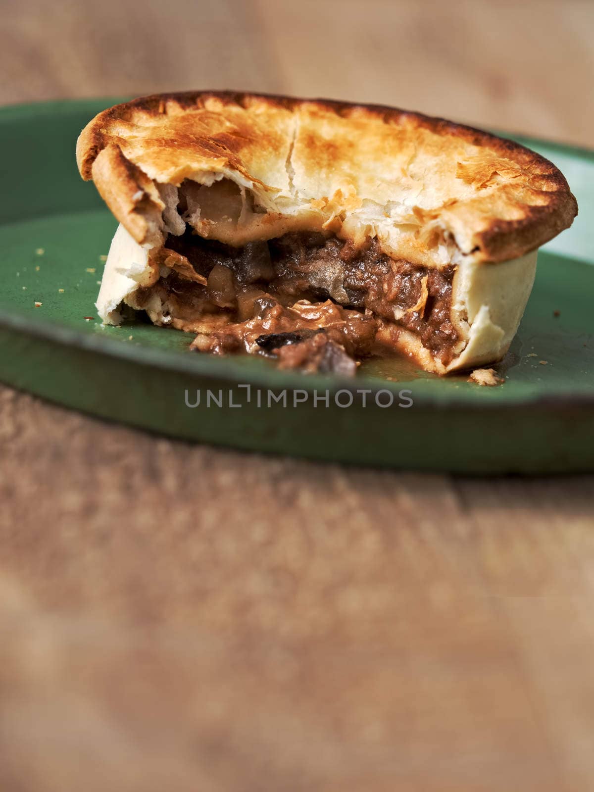 close up of rustic meat and mushroom pie