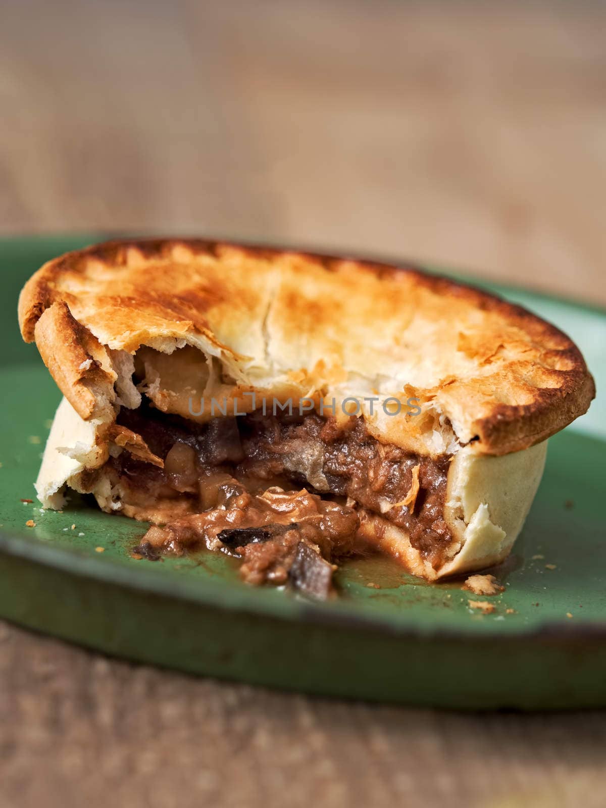 close up of rustic meat and mushroom pie