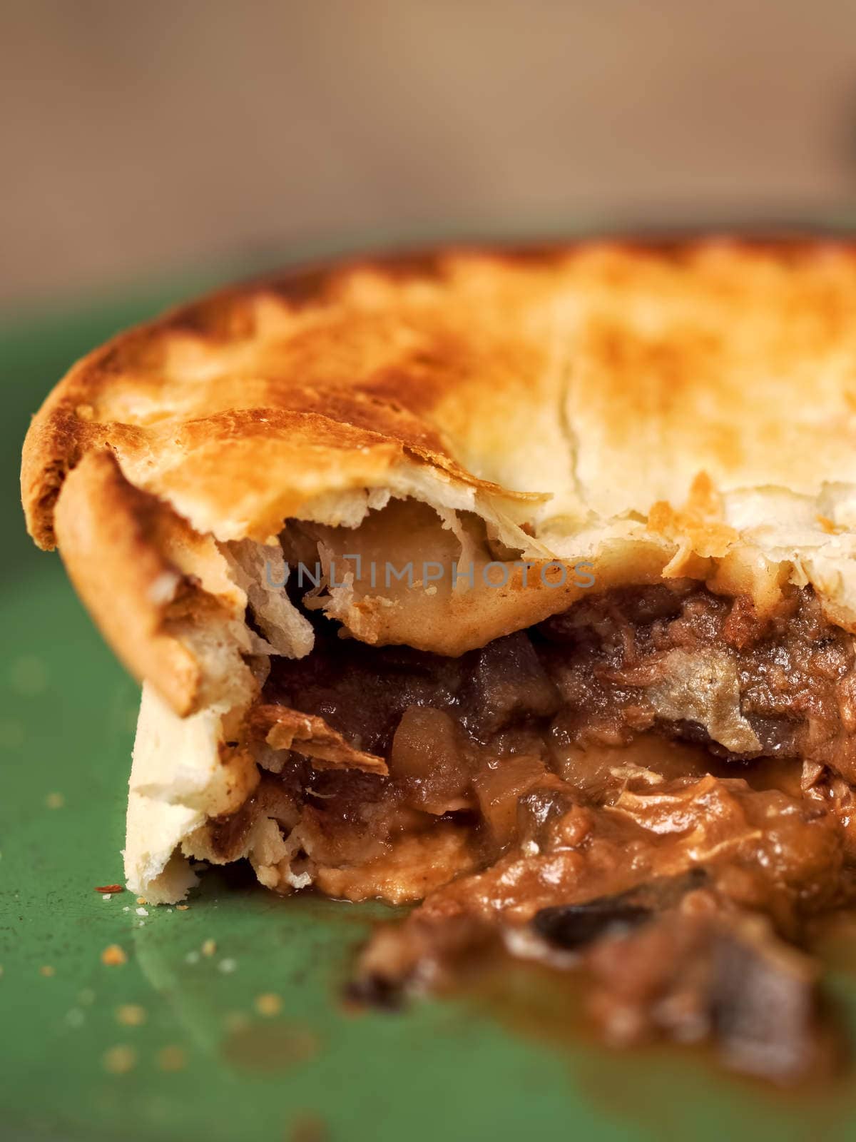 close up of rustic meat and mushroom pie