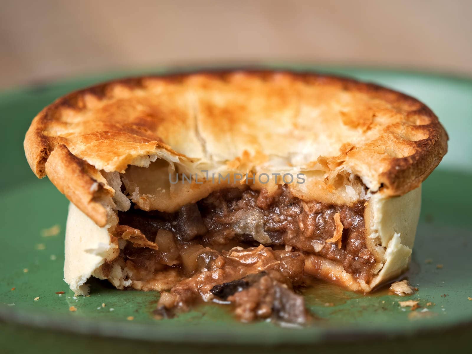 close up of rustic meat and mushroom pie