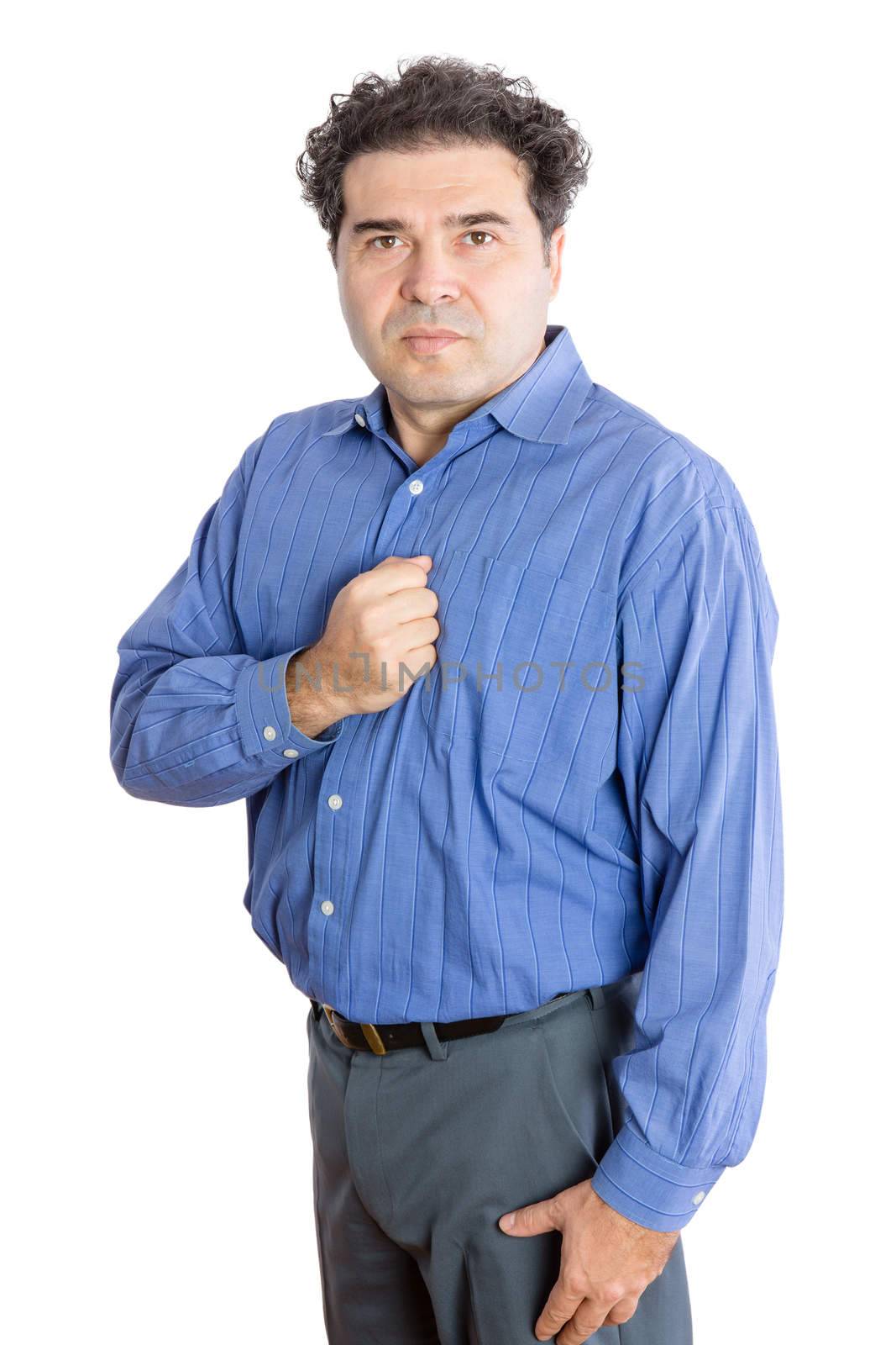 Three Quarter Shot of a Middle-Aged Businessman Putting his Fist on his Chest and Looking at the Camera. Isolated on a White Background.