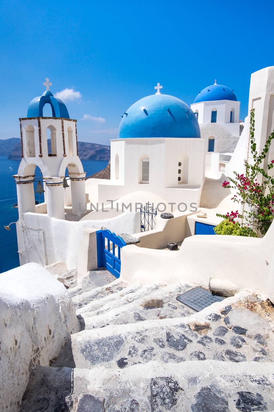 Scenic view of traditional cycladic white houses and blue domes  by martinm303