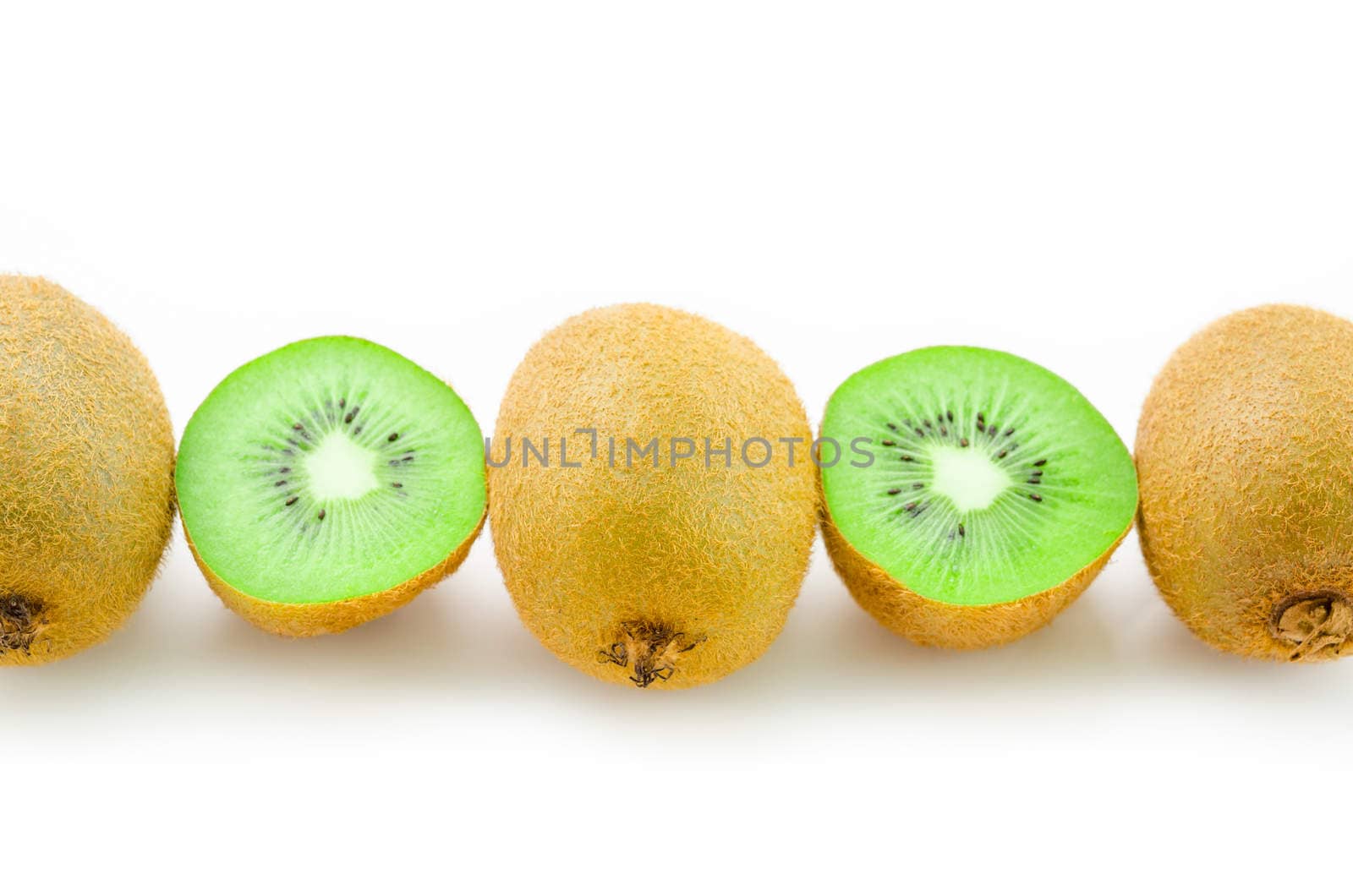 Row of Fresh kiwi fruit and half kiwi on white background.