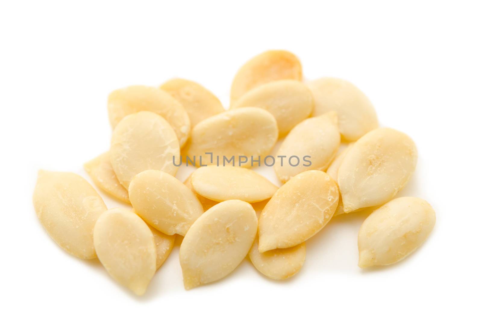 Crack shell watermelon seeds on white background.