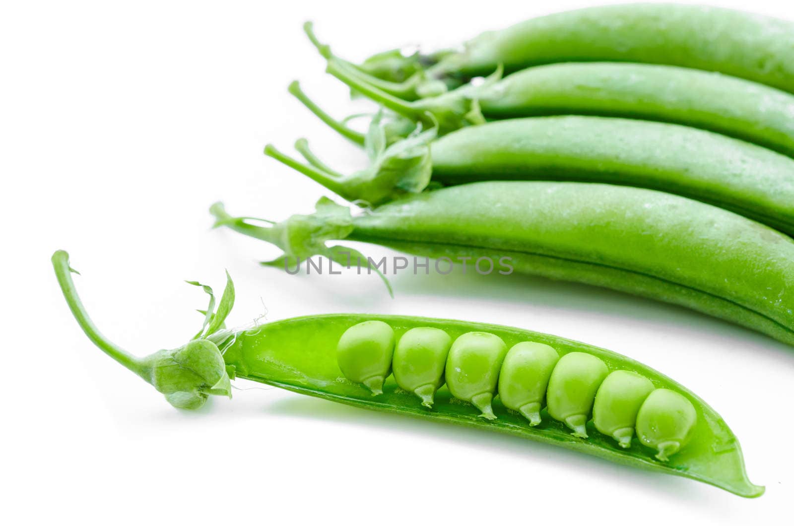 sugar snaps peas on a white background.