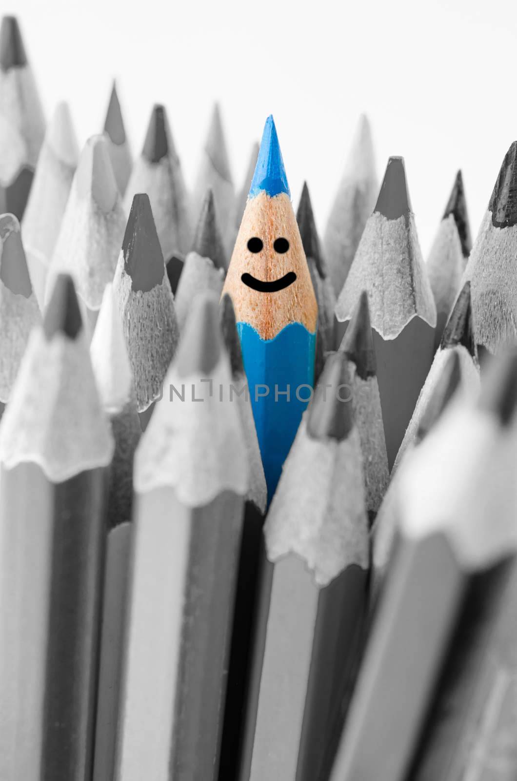Focus blue color and no colouring crayon pencils on white background. Leadership concept.