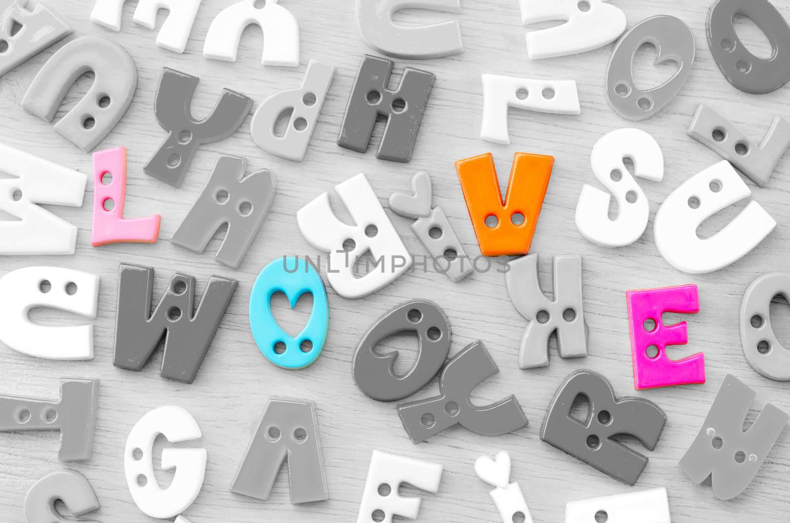 Colorful of love word plastic alphabet on no color many alphabet.