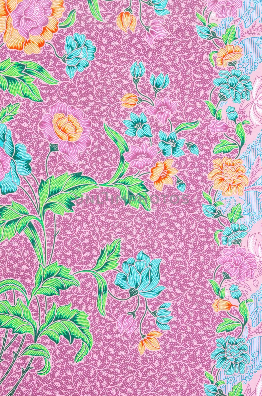 Colorful batik cloth fabric pattern. by Gamjai