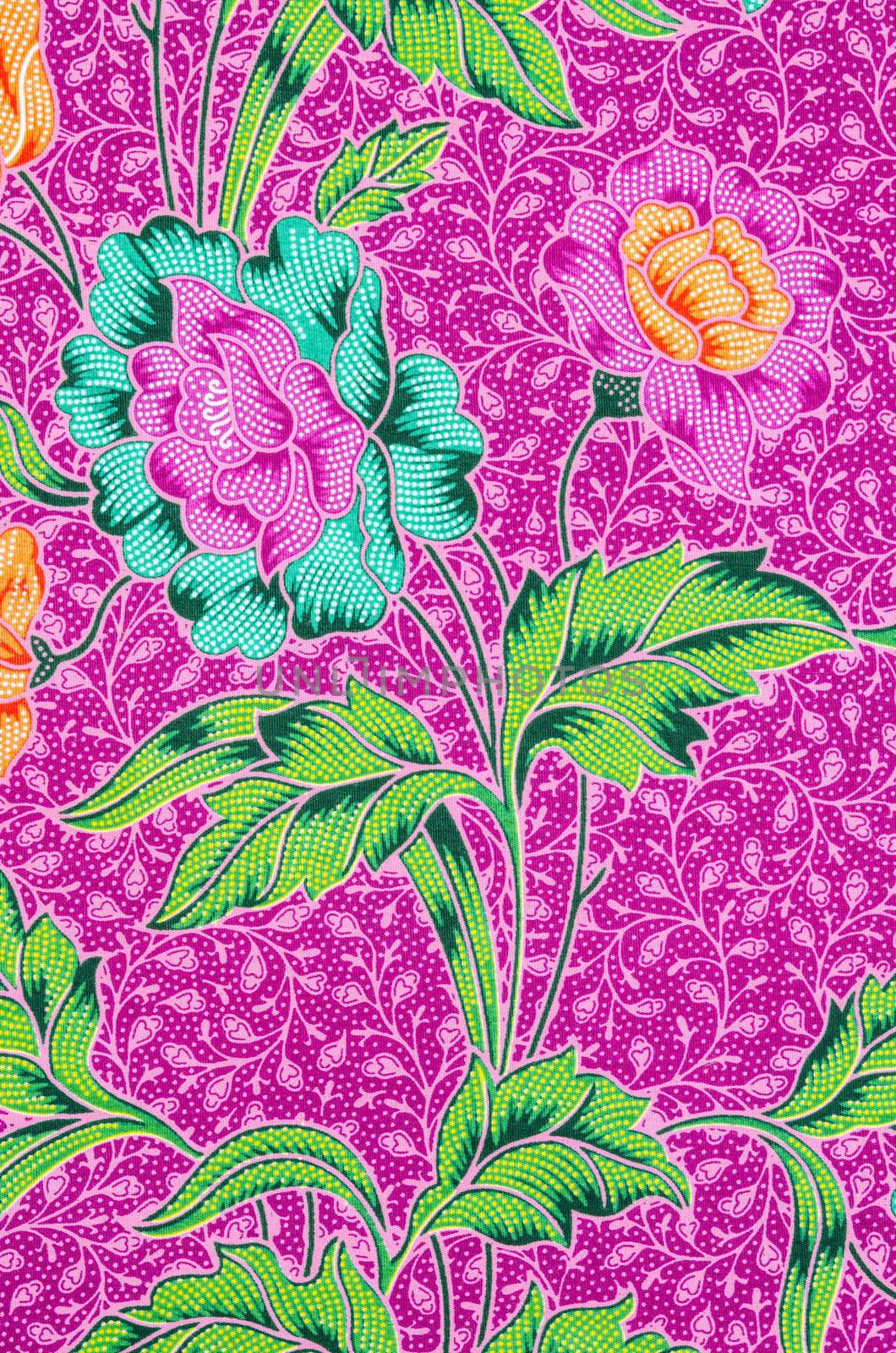 Colorful batik cloth fabric pattern. by Gamjai