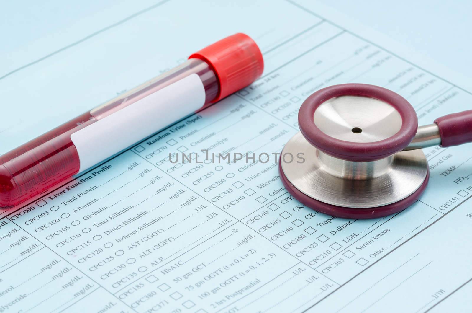 Stethoscope tube of blood and medical check list in laboratory.