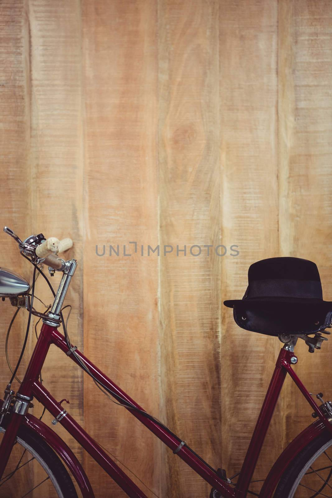 Close up view of a bicycle against wooden background