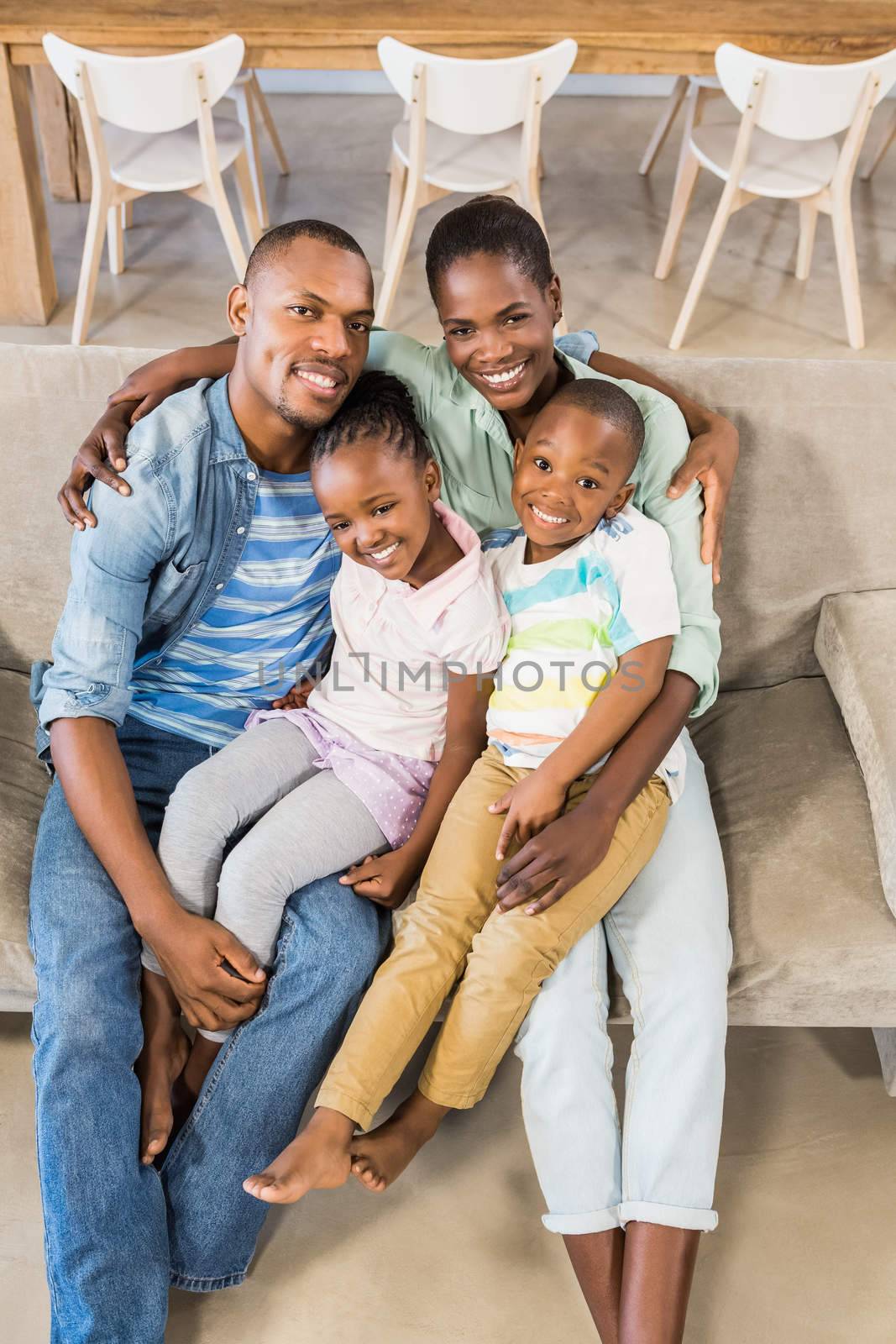 Happy family relaxing on the couch in living room