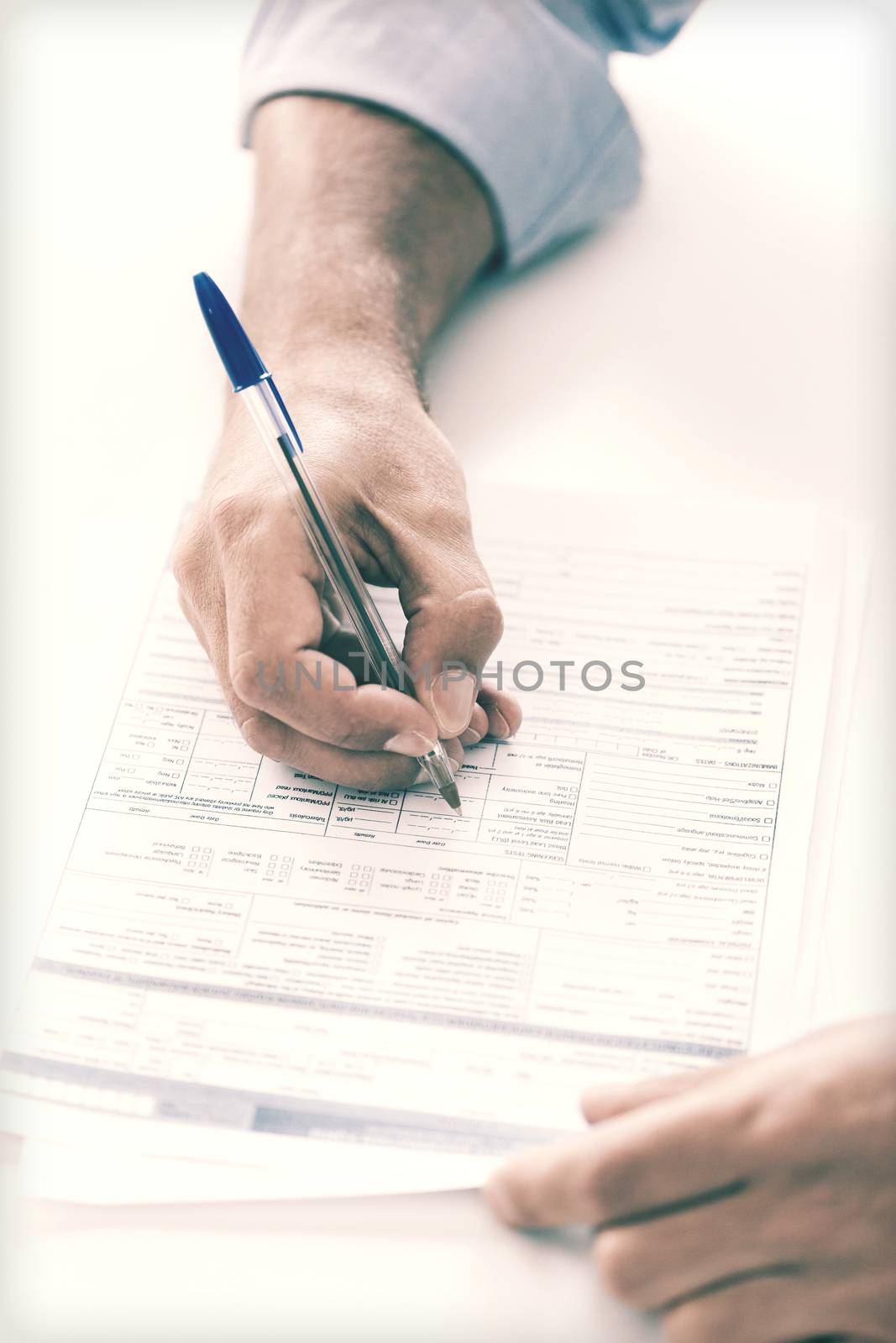 man signing a contract by dolgachov