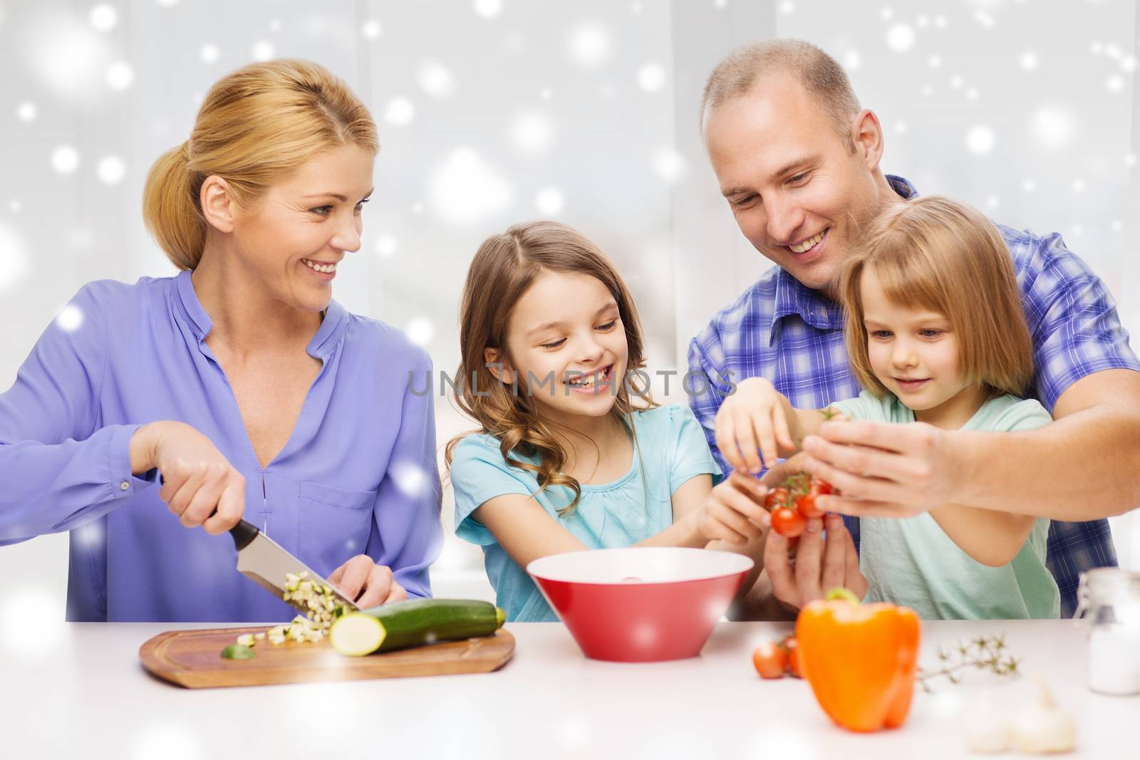 food, family, children, happiness and people concept - happy family with two kids making dinner at home