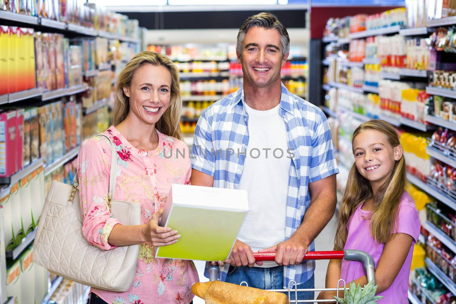 Happy family in the supermarket by Wavebreakmedia