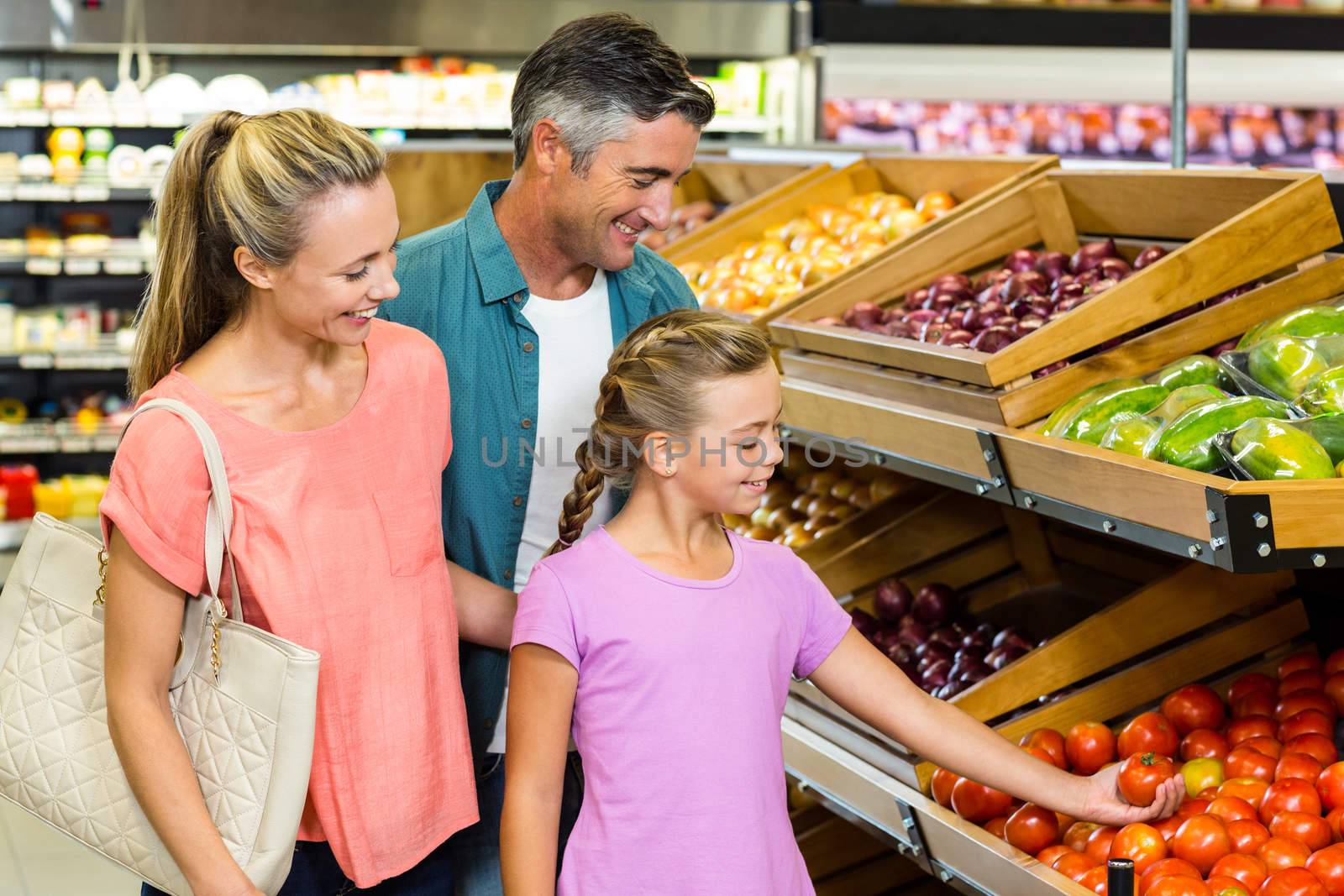 Young family doing some shopping at supermarket