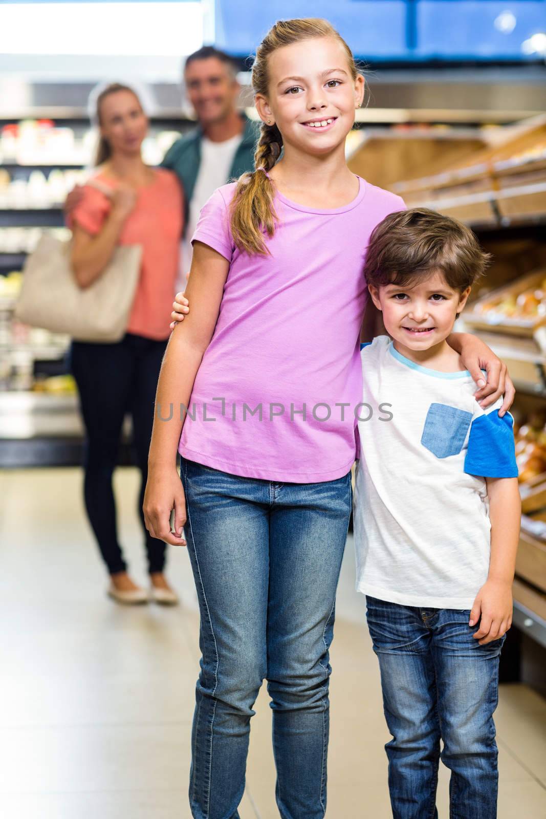 Young family doing some shopping at supermarket