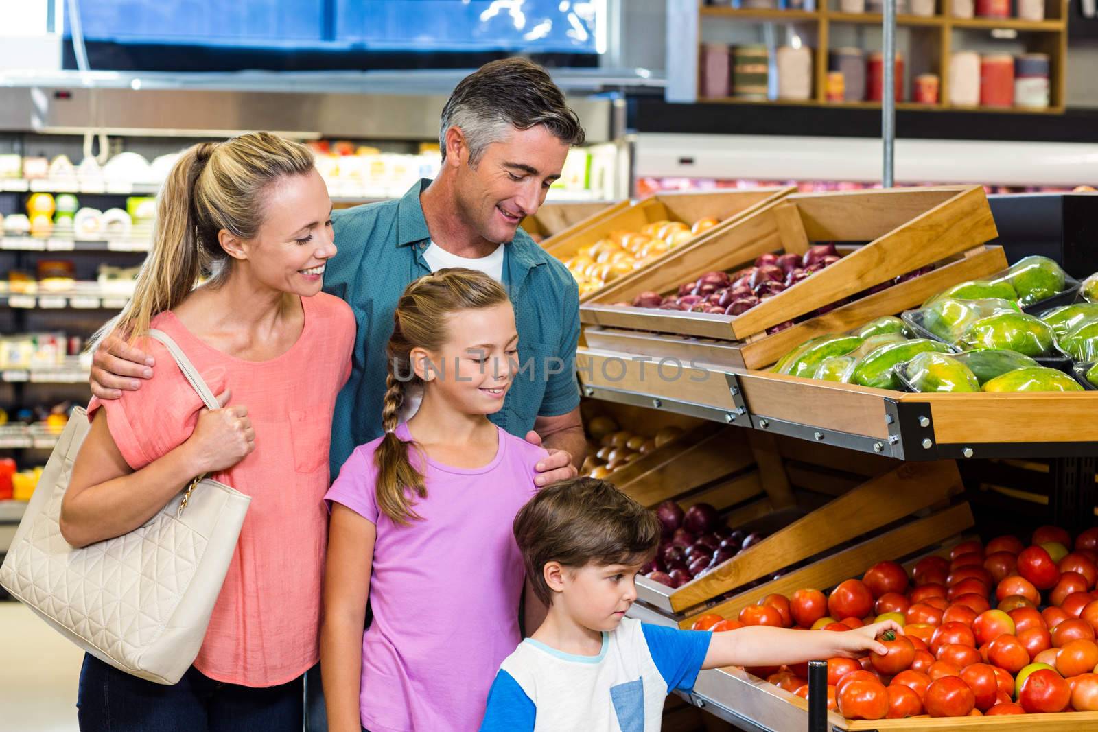 Young family doing some shopping at supermarket