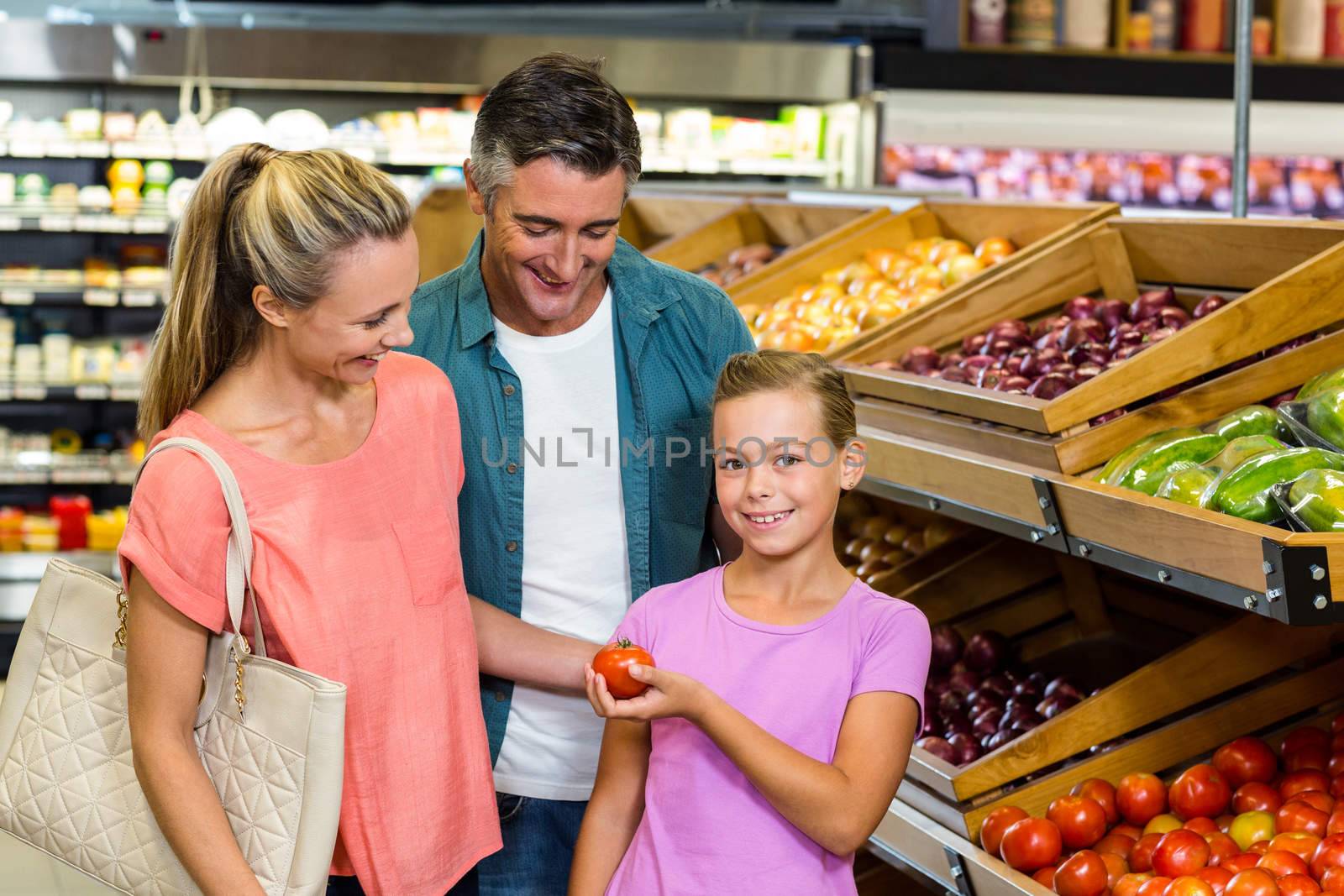 Young family doing some shopping at supermarket