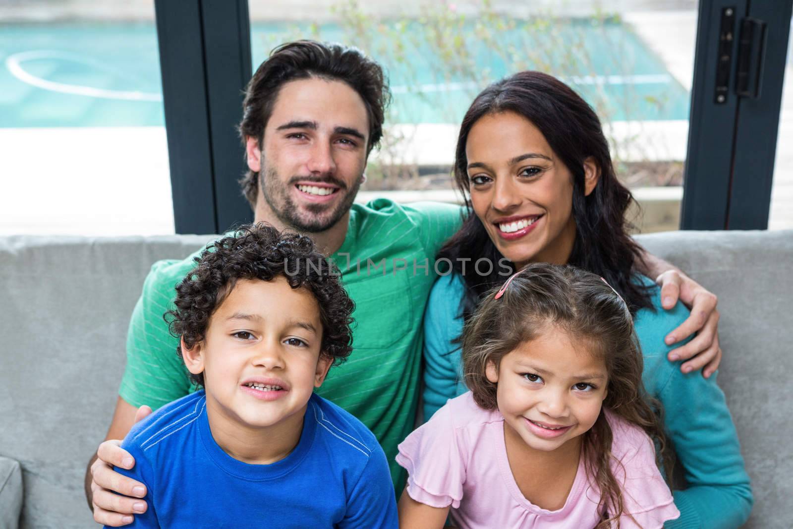 Portrait o happy family on the sofa in living room