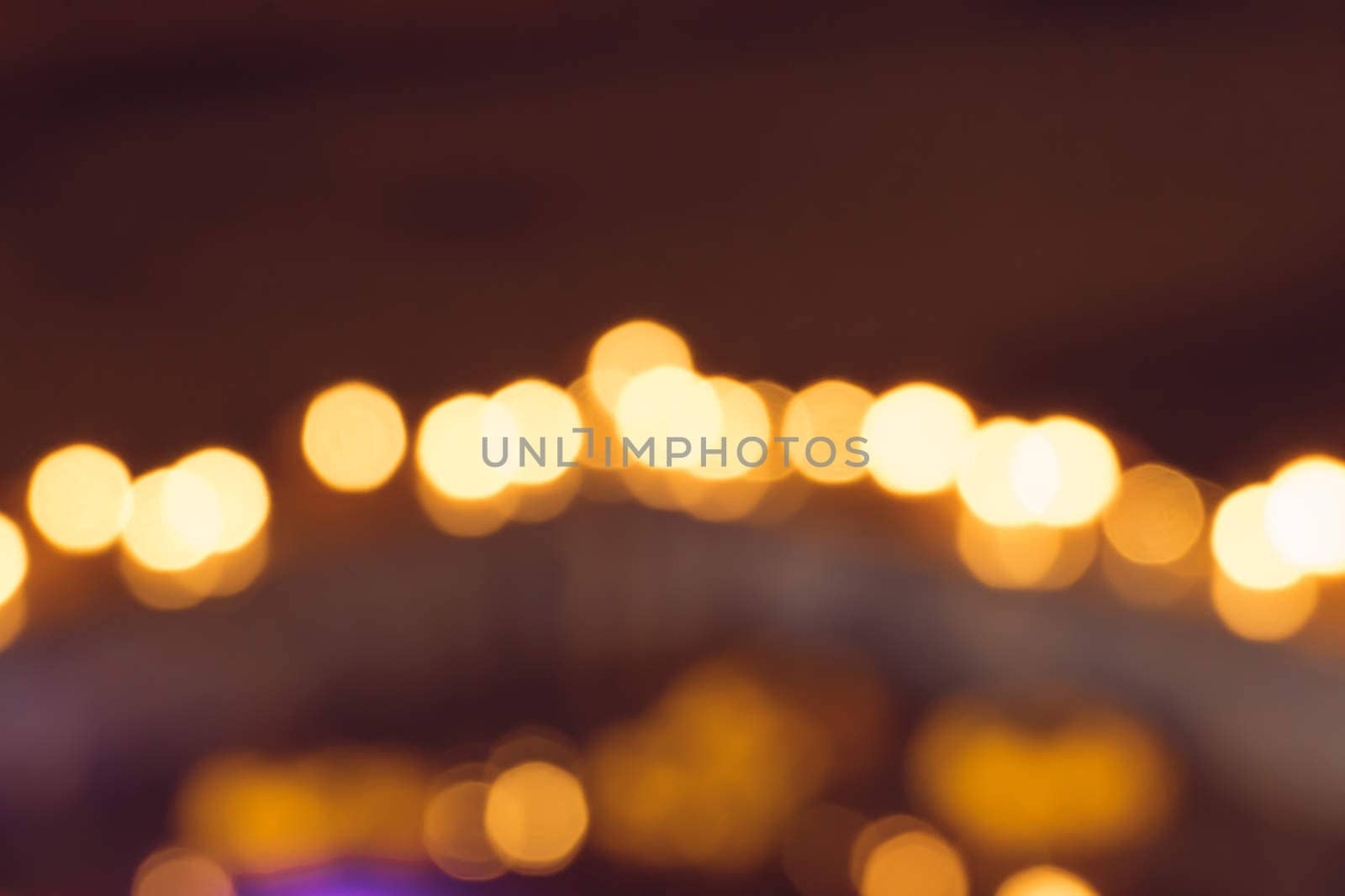 blurred city lights in the night by teerawit