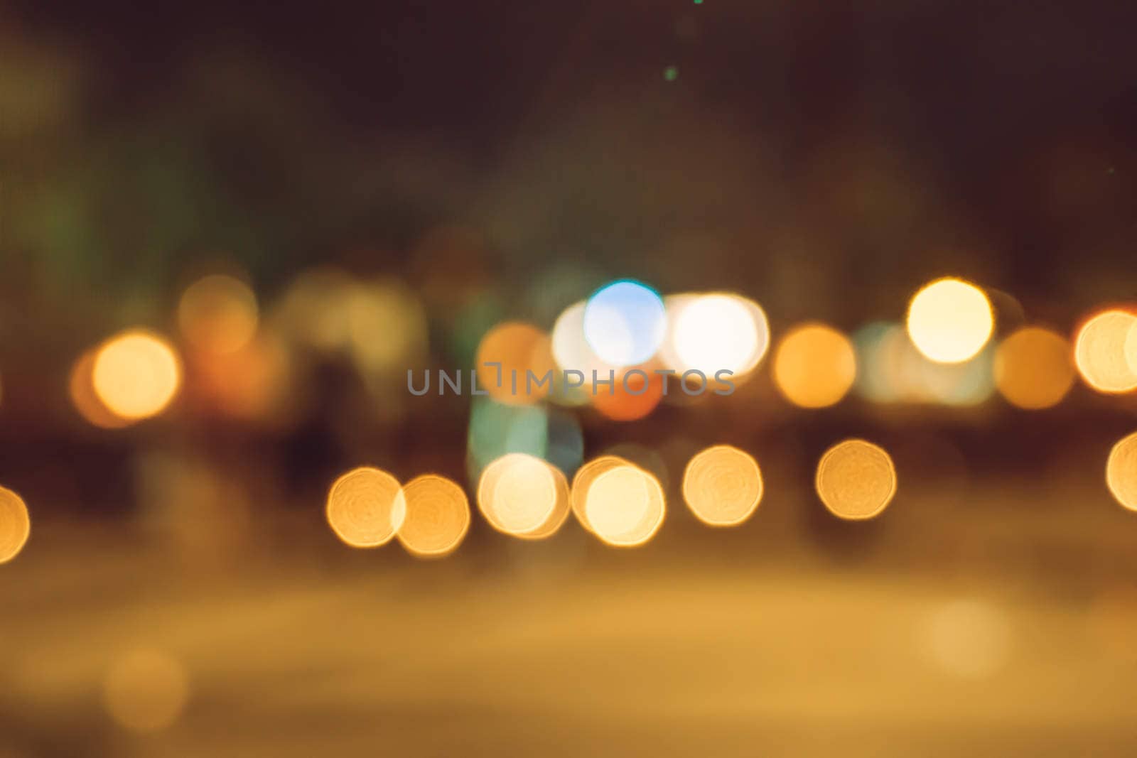 blurred city lights in the night by teerawit