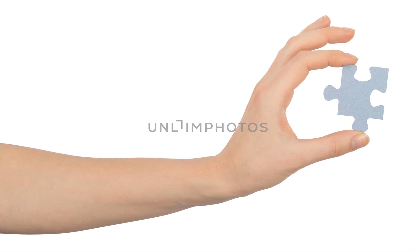 Hand holding puzzle piece on isolated white background