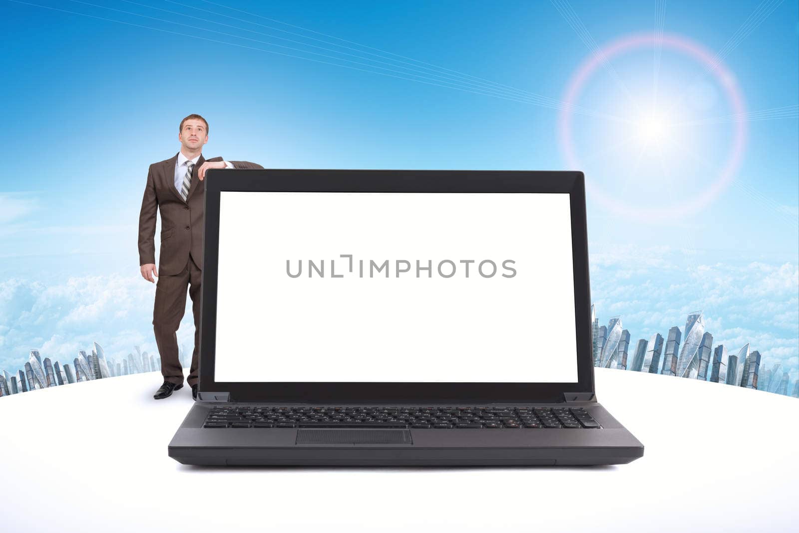 Businessman and big laptop with blank screen, front view
