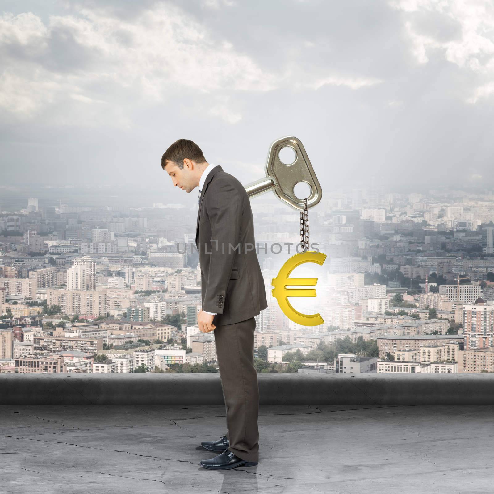 Businessman with key in back and euro sign by cherezoff