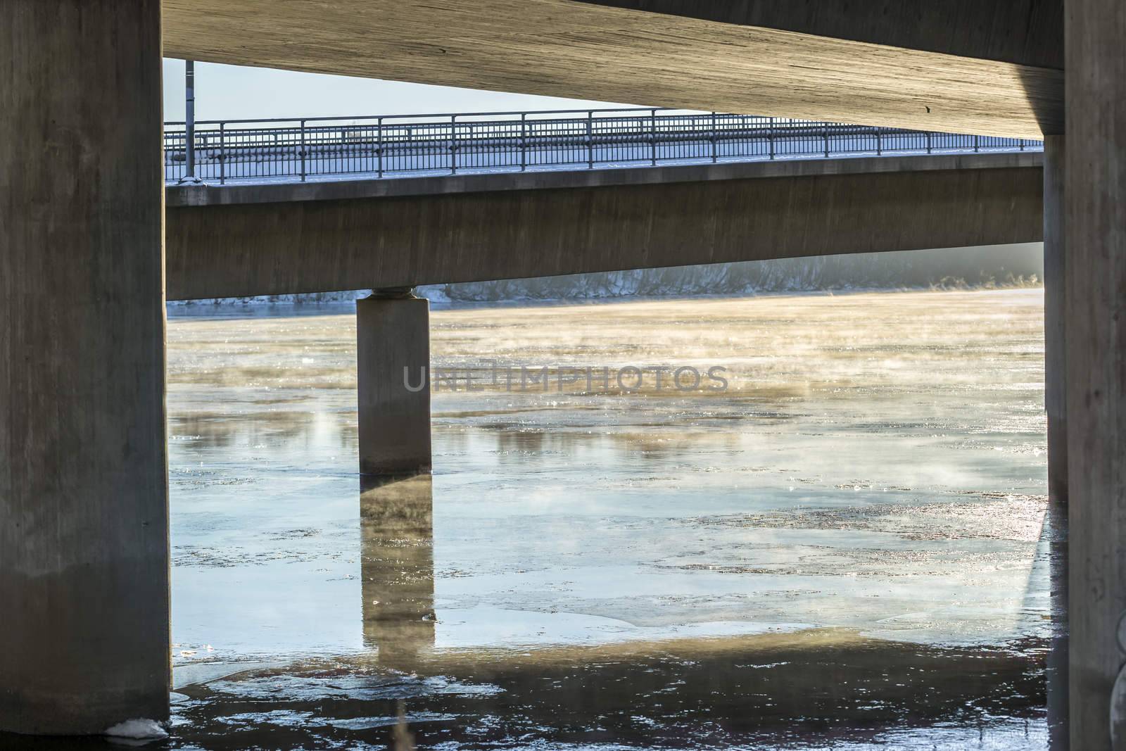 Mist on Icy River under Bridge in Umea, Sweden