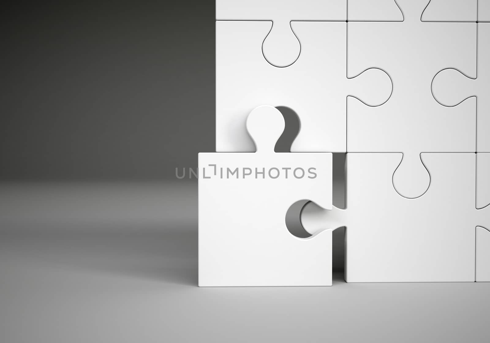 Puzzle pieces on grey background, close up view