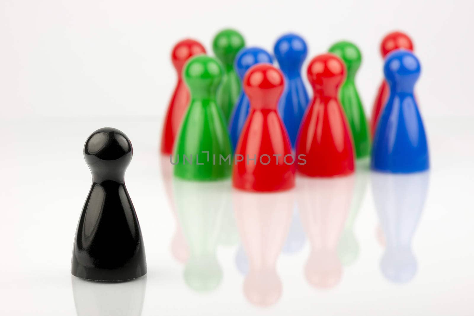 Conceptual game pawns that depict the concept different
