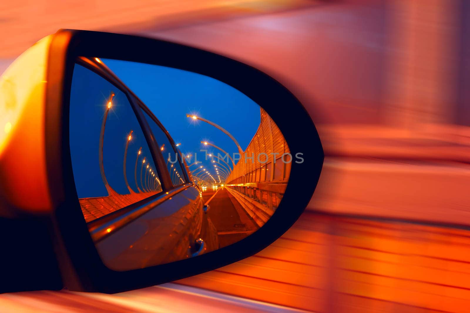 Reflection of  hidgway in the mirror of a car