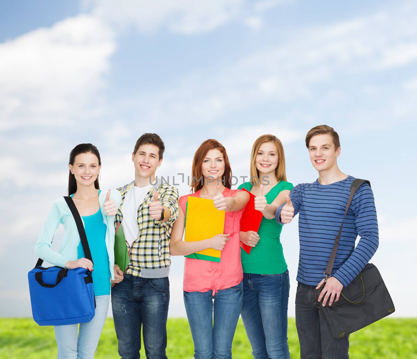 education and people concept - group of smiling students standing