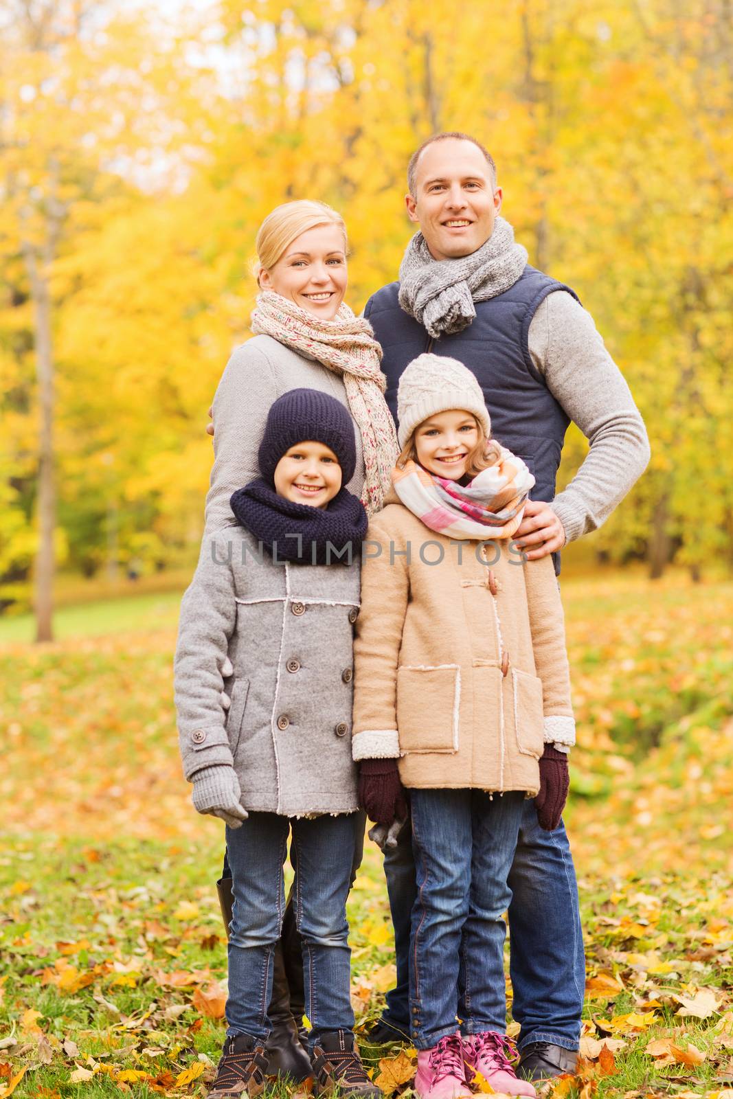 happy family in autumn park by dolgachov