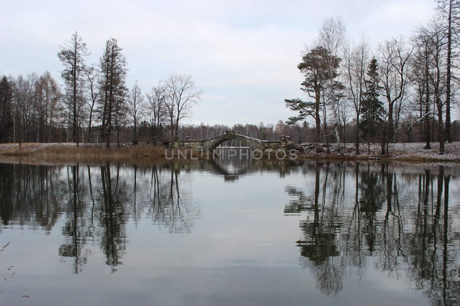 Humpback Bridge in Gatchina park, uniting the two islands in the White Lake. Leningrad, November 2015