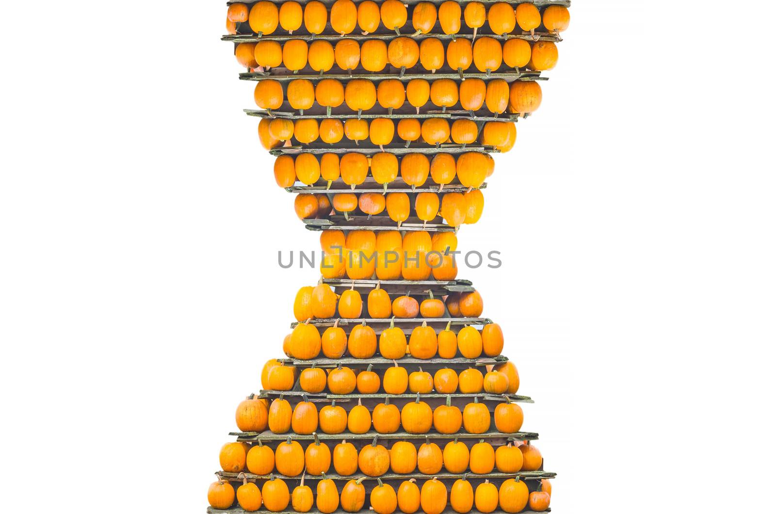 Decorative pumpkins stacked in a pyramid shape. Isolated.