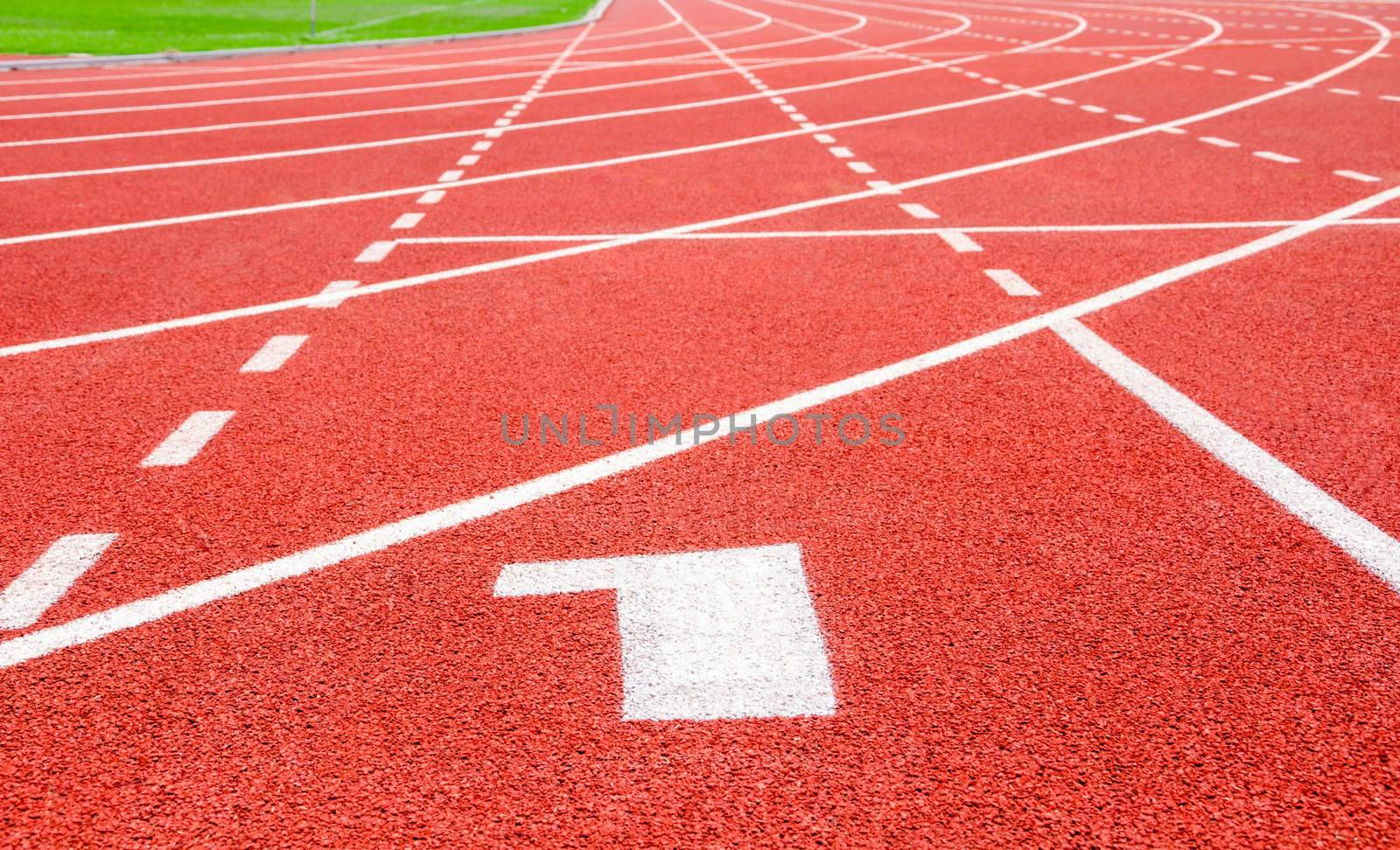 Start track. Lanes 1 number one on red racing track.