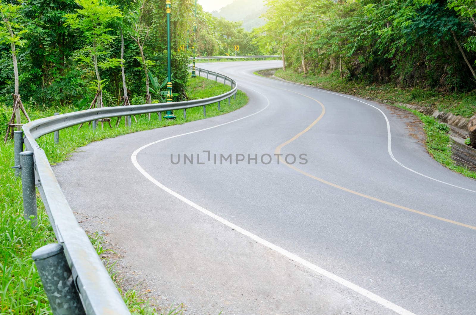 Road on mountain in country, S-shape.
