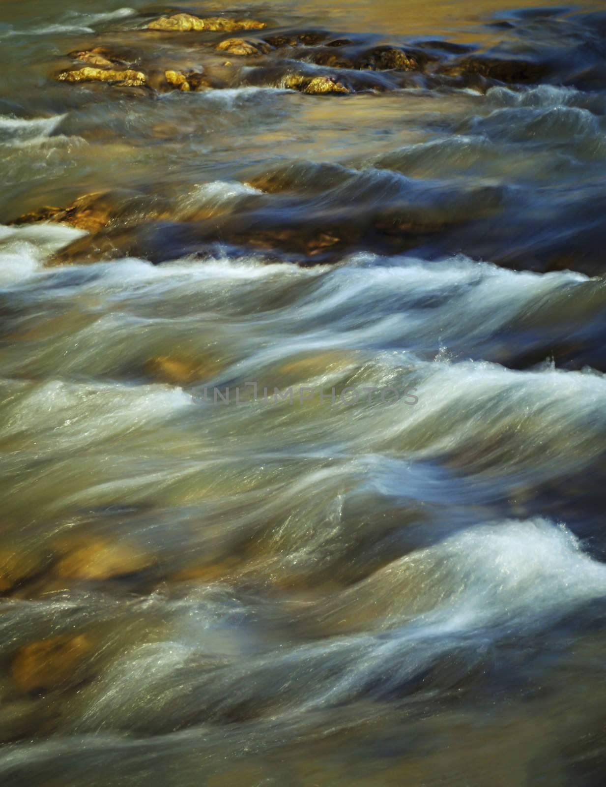 abstract seasonal background evening autumn river with rapids