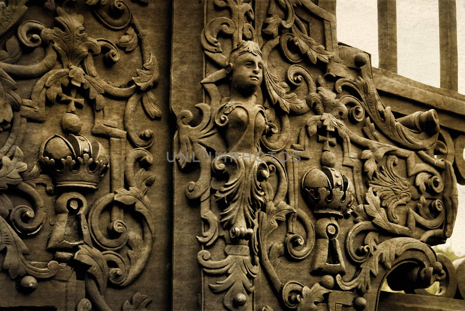 Vintage forged decorative element on metal gate in old part of Vienna, Austria.  Photo in old color image style.