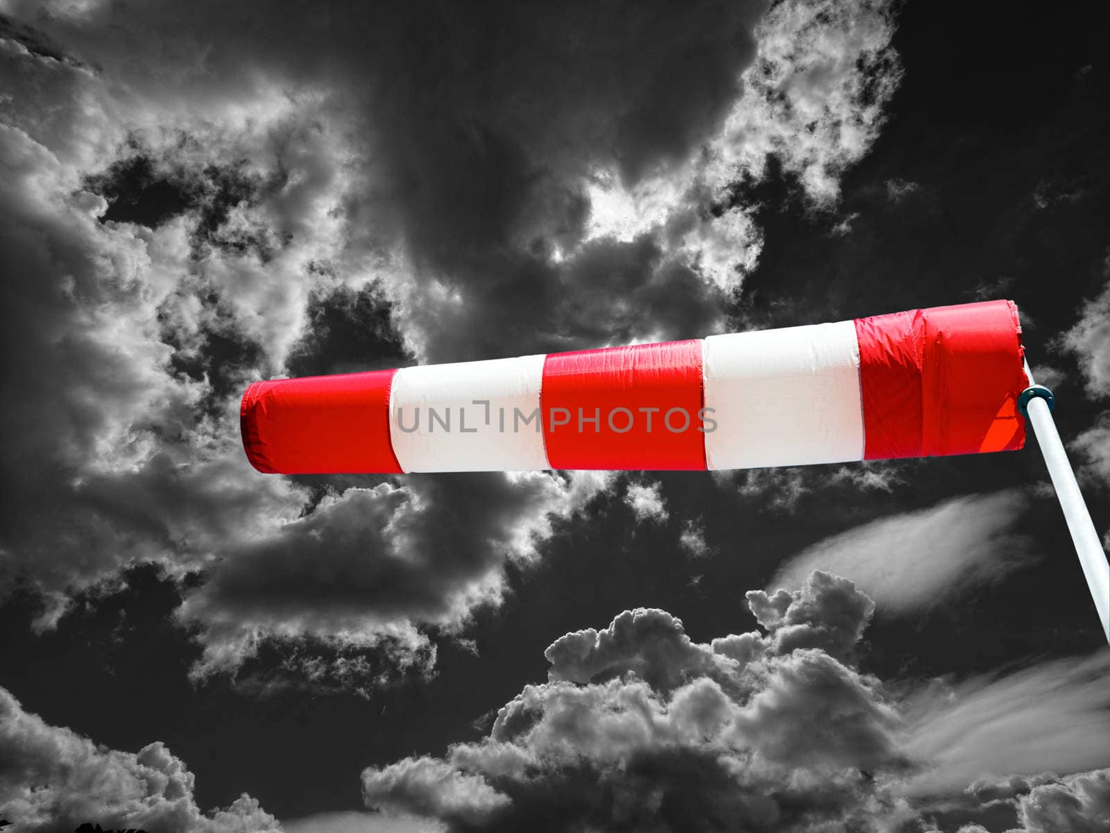 windsock against black clouds