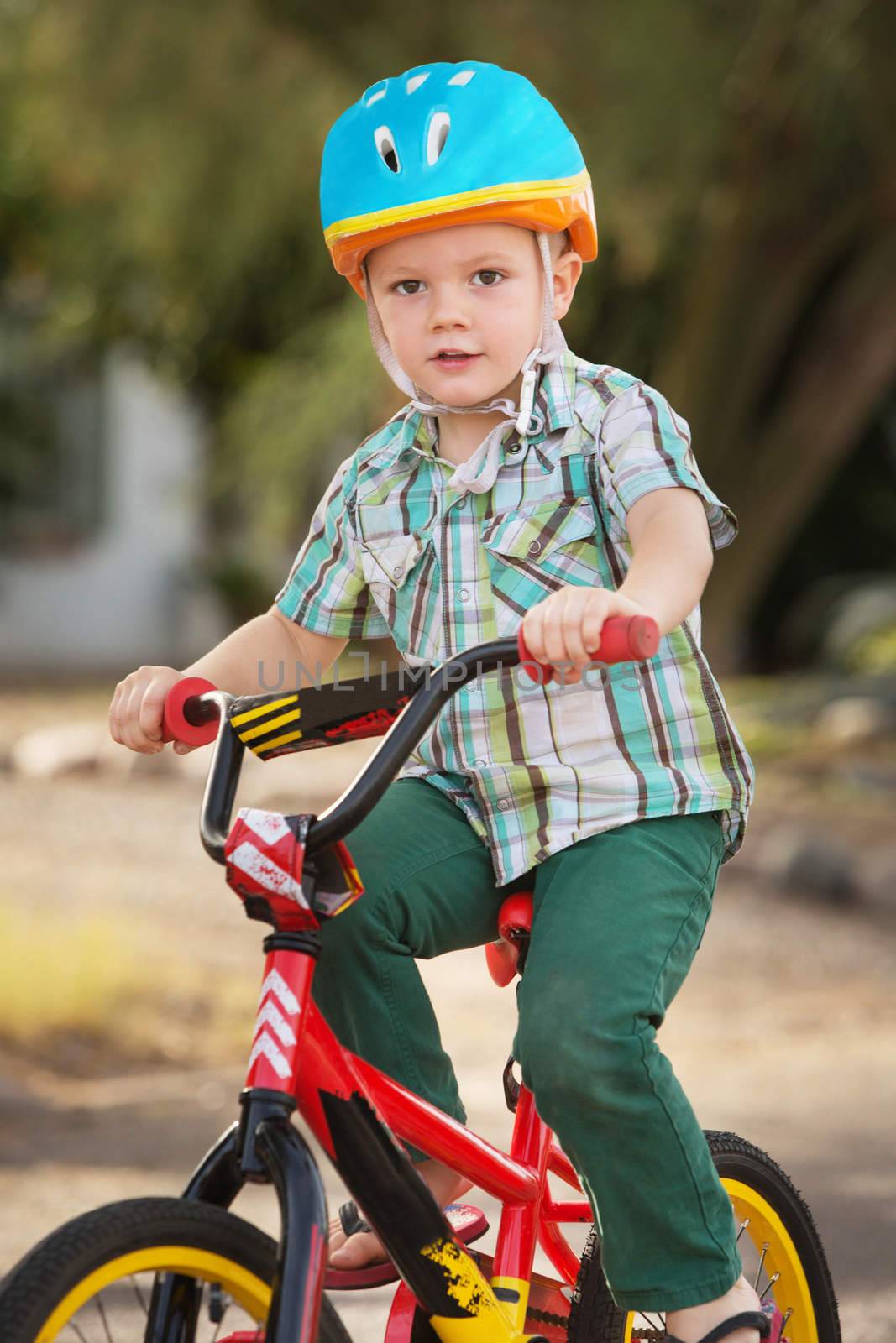 Single child in helmet riding a bicycle
