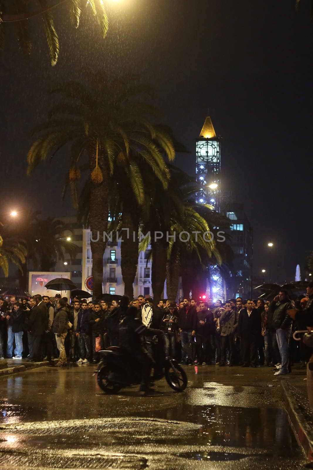 TUNISIA, Tunis: A crowd has formed as police and medical crews are on the scene of an explosion in Tunis, Tunisia that killed at least 12 people aboard a military bus on November 24, 2015. The bus was transporting members of the presidential guard when a bomb exploded just before 5pm local time; and was reportedly parked near the street Habib Bourguiba, where Tunisia's Interior Ministry and French Embassy are situated.